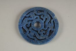 A CHINESE PIERCED LAPIS ROUNDEL. 2.75ins.