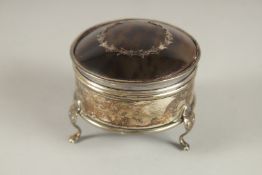A SILVER AND TORTOISESHELL CIRCULAR PIN BOX with blue liner, on three claw feet. 2.5ins.
