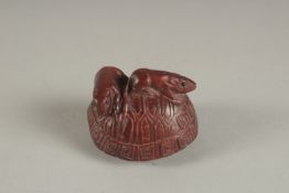 A CARVED HARDWOOD TURTLE SHELL AND MICE NETSUKE. Signed. 1.75ins.