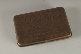 A REPLICA BRASS COCAINE BOX.