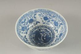 A CHINESE BLUE AND WHITE CIRCULAR RICE BOWL. 6ins diameter.