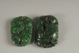TWO CARVED JADE PENDANTS.