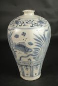 A CHINESE OCTAGONAL BLUE AND WHITE PORCELAIN MEIPING VASE, with fish and algae. 29cms high.