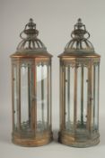 A SMALL PAIR OF COPPER CIRCULAR LANTERNS. 23cms high.