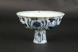 A CHINESE BLUE AND WHITE PETAL SHAPE STEM CUP. 15.5cms wide.