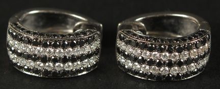 A CERTIFICATED WEIGHTY PAIR OF 14CT WHITE GOLD HALF HOOP EARRINGS set with natural black and white