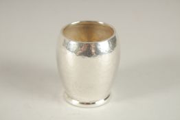 AN ILIAS LALAOUNIS SILVER HAMMERED BEAKER. 2.25ins. Weight 47grms.