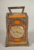 A RARE VICTORIAN SILVER AND AMBER CLOCK, 4ins high, the silver case set with amber panels and
