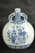 A CHINESE BLUE AND WHITE PORCELAIN PHOENIX MOON FLASK. 28cms high.