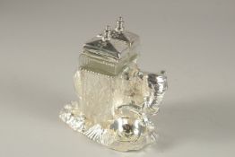 A SILVER-PLATED ELEPHANT CRUET.