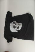 A DAMIEN HIRST SKULL TEESHIRT.