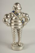 A SILVER-PLATED MICHELIN MAN. 14.5ins high.