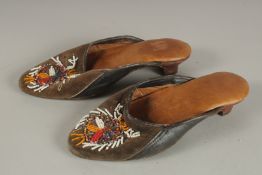 A PAIR OF BEADWORK DECORATED SHOES. 25cms long.