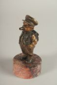 A RARE BERGMANN BRONZE LIGHTER as a small Dutch boy smoking a cheroot and standing on a circular