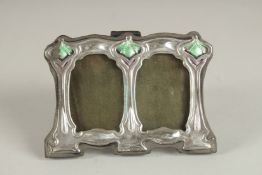 A SMALL SILVER AND ENAMEL DOUBLE PHOTOGRAPH FRAME. 2.75ins x 3.75ins.