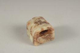 A SMALL CHINESE CARVED JADE SEAL. 1cm square.