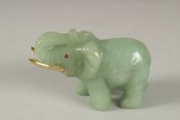 A RUSSIAN CARVED JADE ELEPHANT with silver gilt tusks and stone eyes. Maker H. W. Faberge, in a