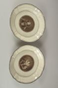 A PAIR OF FRENCH PORCELAIN DISHES, decorated to the centre with a portrait. 29cms diameter.