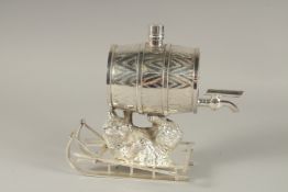 A SILVER-PLATED BEAR BARREL and a sledge.