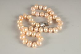 A STRING OF LARGE PEARLS. 20ins long.