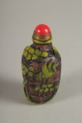 A CHINESE CARVED SNUFF BOTTLE.