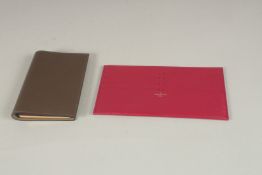 A LOUIS VUITTON LEATHER CARD HOLDER 7ins x 4ins, and a HERMES NOTEBOOK 5.25ins x 4ins.
