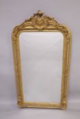 A GOOD LOUIS XVITH STYLE GILTWOOD ROCOCO MIRROR with scrolls and acanthus. 63ins high x 31ins wide.