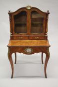 A GOOD 19TH CENTURY KINGWOOD AND WALNUT BONHEUR-DU-JOUR, the serpentine shaped top with a pair of