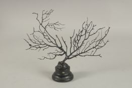 A BLACK CORAL SPECIMEN on a wooden base. 8ins.