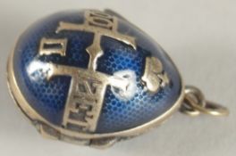 A SILVER AND BLUE ENAMEL EGG SHAPED LOCKET.