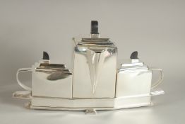 A SILVER-PLATED DECO TEA SET.