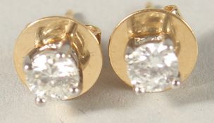 A PAIR OF 18CT WHITE GOLD AND DIAMOND EAR STUDS, 0.45ct.