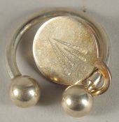 A TIFFANY SILVER KEYRING.