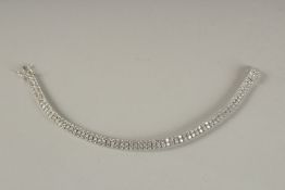 A SILVER CZ LINE BRACELET.