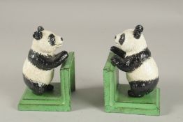 A PAIR OF CAST IRON PANDA BOOKENDS.
