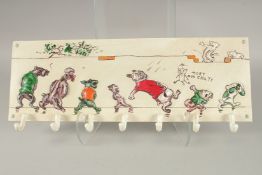 A CAST IRON DOG WALL HOOK. 20ins long.