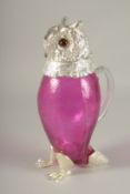 A SILVER-PLATED AND CRANBERRY GLASS OWL CLARET JUG. 11.5ins high.