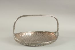 A WMF SILVER PLATED BASKET WEAVE FORM BASKET with strap handle. 33cms long.