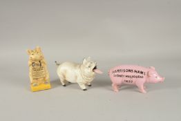 THREE PAINTED CAST IRON PIGS.