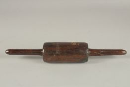A SMALL TURNED WOOD ROLLING PIN. 34cms long.