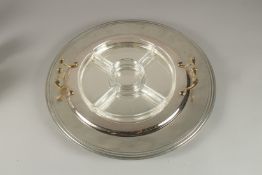A TWO HANDLED CIRCULAR SERVING DISH. 18ins diameter.