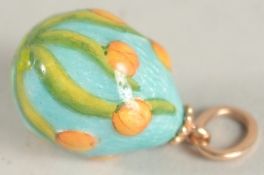 A RUSSIAN 14CT GOLD AND ENAMEL LILY EGG PENDANT.