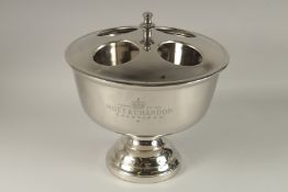 A MOET & CHANDON FOUR BOTTLE CIRCULAR WINE COOLER. 15ins diameter x 12ins high.