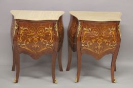 A SMALL PAIR OF LOUIS XVITH DESIGN INLAID BOMBE FRONTED COMMODES with two drawers and marble top.