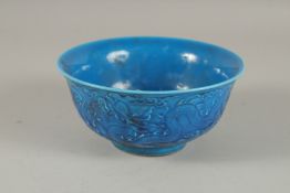 A CHINESE BLUE CIRCULAR RICE BOWL. 6ins diameter.
