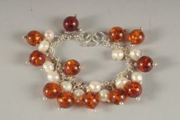 A SILVER, AMBER AND PEARL BRACELET.