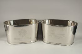 A PAIR OF OVAL BOLLINGER WINE COOLERS. 17ins long x 9.5ins high.
