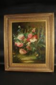 W. LARSEN. A good still life, flowers and plants by a fence. Signed. 24