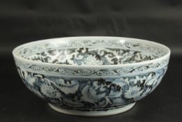 A VERY LARGE CHINESE EXPORT / ISLAMIC MARKET BLUE AND WHITE PORCELAIN FLORAL BOWL, 41cm diameter.