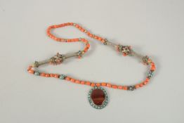 A VERY FINE BUKHARA CORAL BEADED SILVER NECKLACE WITH AGATE PENDANT, adorned with turquoise beads,